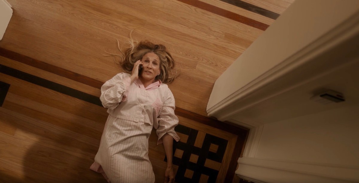 carrie lying on the ground on the phone