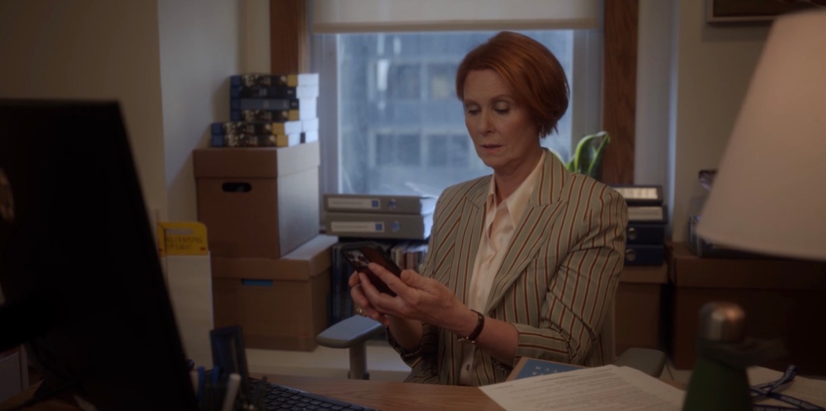 Miranda at her desk with her phoen