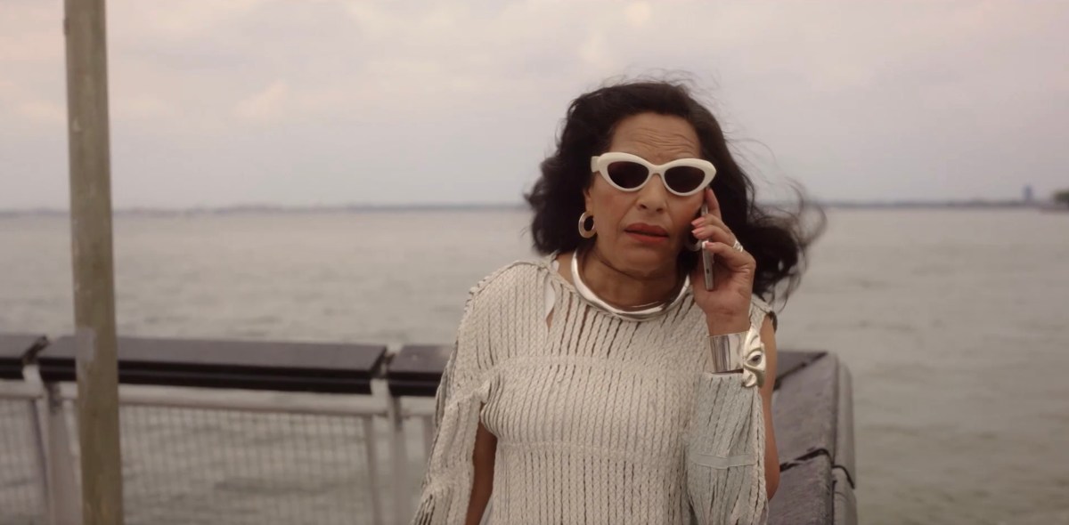 Sima on the phone on the pier
