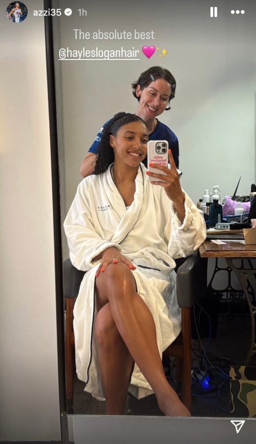 Azzi Fudd getting a haircut