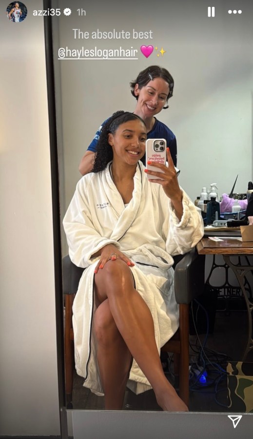 Azzi Fudd getting a haircut