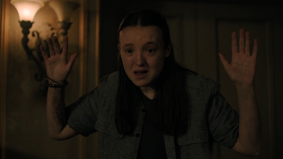 The Last of Us 207 ellie holds her hands up to abby