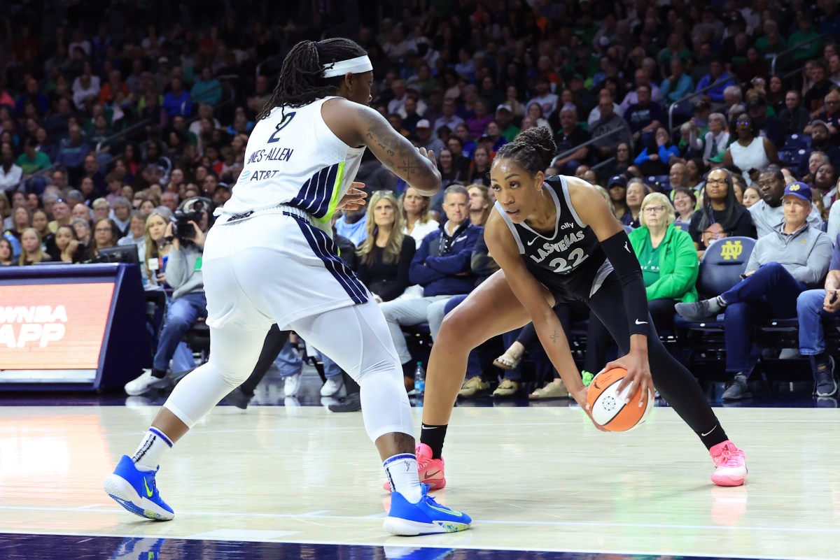 SOUTH BEND, INDIANA - MAY 02: A'ja Wilson #22 of the Las Vegas Aces makes a move on Myisha Hines-Allen #2 of the Dallas Wings during the second quarter during the preseason game at Purcell Pavilion on May 02, 2025 in South Bend, Indiana. NOTE TO USER: User expressly acknowledges and agrees that, by downloading and or using this photograph, User is consenting to the terms and conditions of the Getty Images License Agreement. (Photo by Justin Casterline/Getty Images)