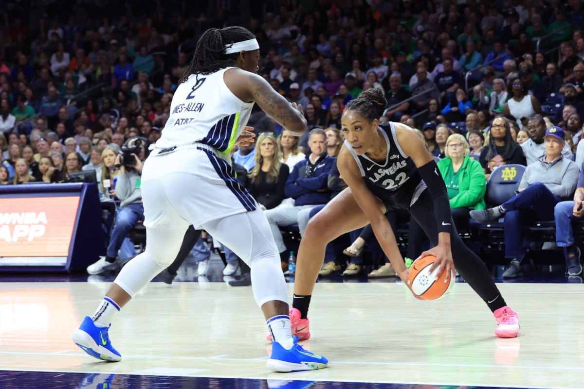 SOUTH BEND, INDIANA - MAY 02: A'ja Wilson #22 of the Las Vegas Aces makes a move on Myisha Hines-Allen #2 of the Dallas Wings during the second quarter during the preseason game at Purcell Pavilion on May 02, 2025 in South Bend, Indiana. NOTE TO USER: User expressly acknowledges and agrees that, by downloading and or using this photograph, User is consenting to the terms and conditions of the Getty Images License Agreement. (Photo by Justin Casterline/Getty Images)