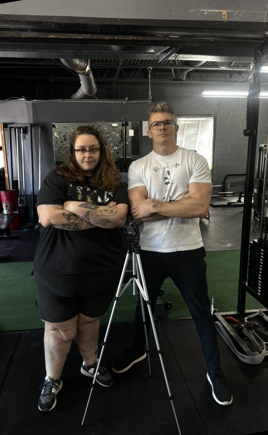 Stef and Brendan posing with a camera