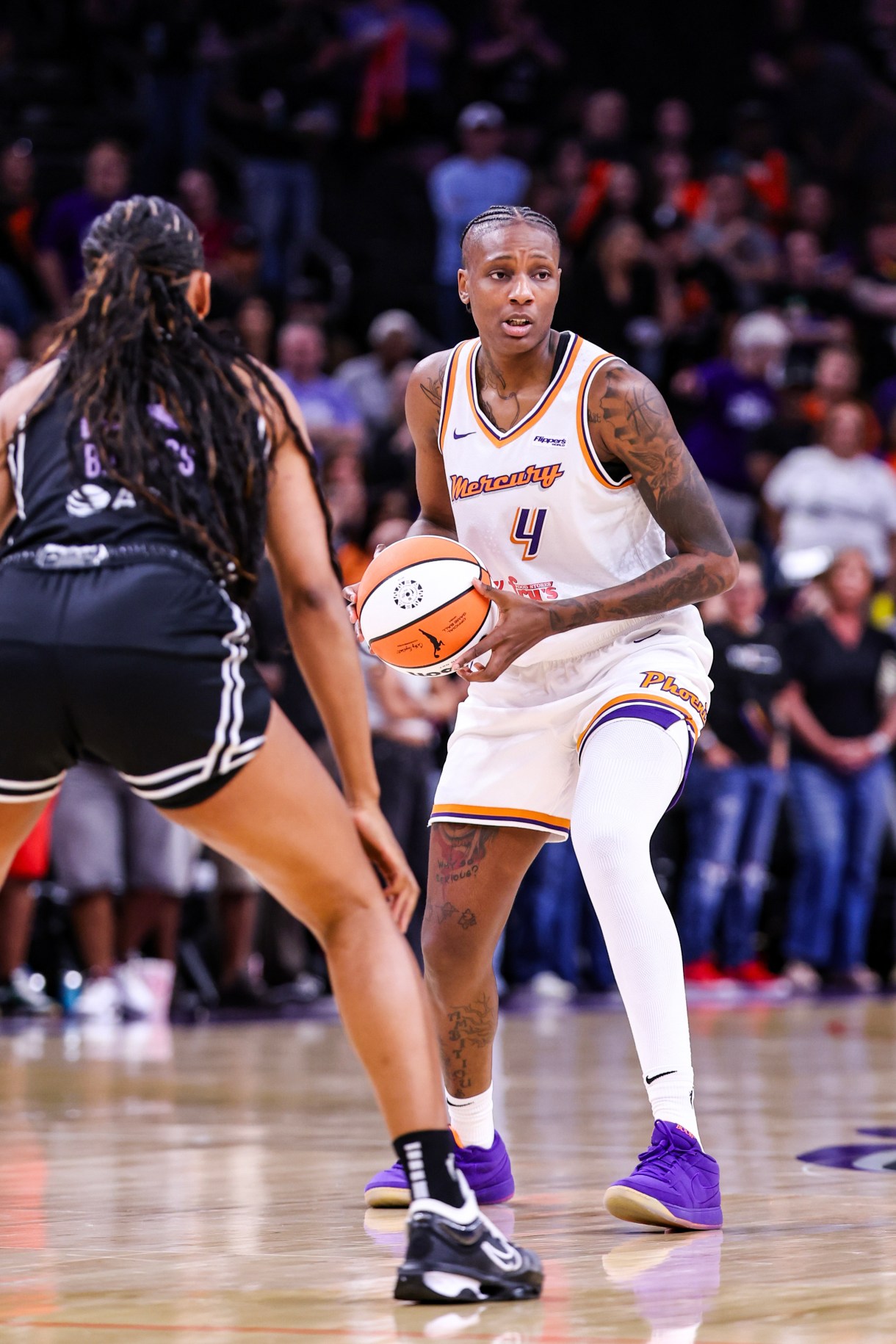 PHOENIX, ARIZONA - MAY 11: Natasha Mack#10 of the Phoenix Mercury looks to pass the ball during the first quarter against the Golden State Valkyries at PHX Arena on May 11, 2025 in Phoenix, Arizona.