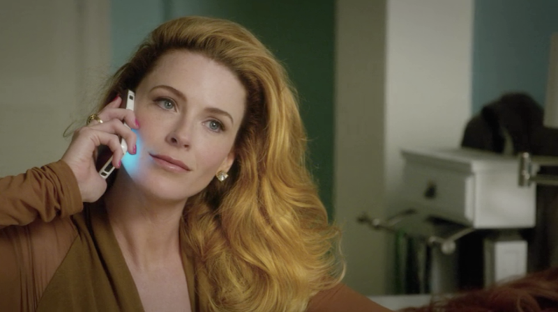 Rose from Jane the Virgin is on the phone, her luscious hair flipped to one side
