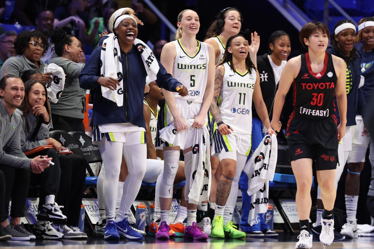 ARLINGTON, TEXAS - MAY 10: Arike Ogunbowale #24, Paige Bueckers #5, and JJ Quinerly #11 of the Dallas Wings celebrate on their bench after a score during the second half of a preseason game against the Toyota Antelopes at College Park Center on May 10, 2025 in Arlington, Texas. NOTE TO USER: User expressly acknowledges and agrees that, by downloading and or using this photograph, User is consenting to the terms and conditions of the Getty Images License Agreement. (Photo by Sam Hodde/Getty Images)