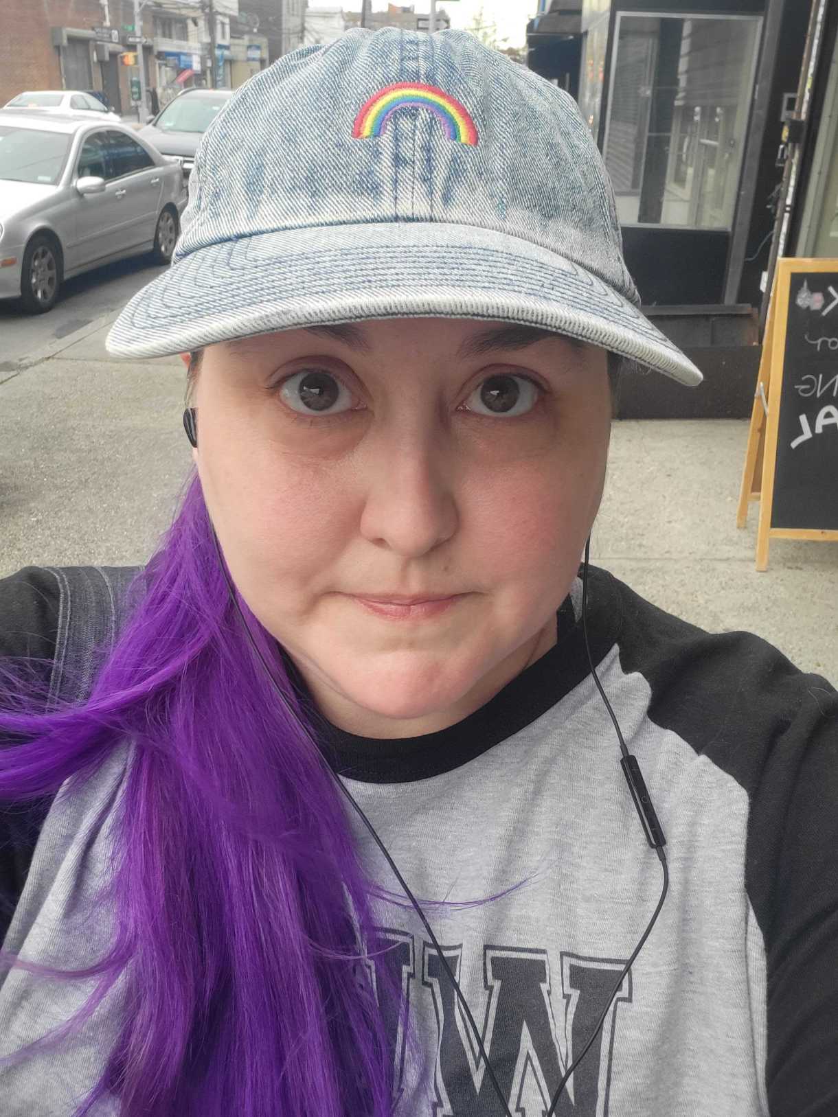 Valerie walking through the gayborhood