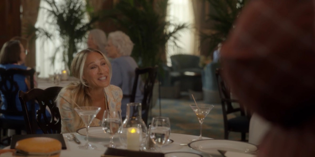 Carrie at the dinner table is happy