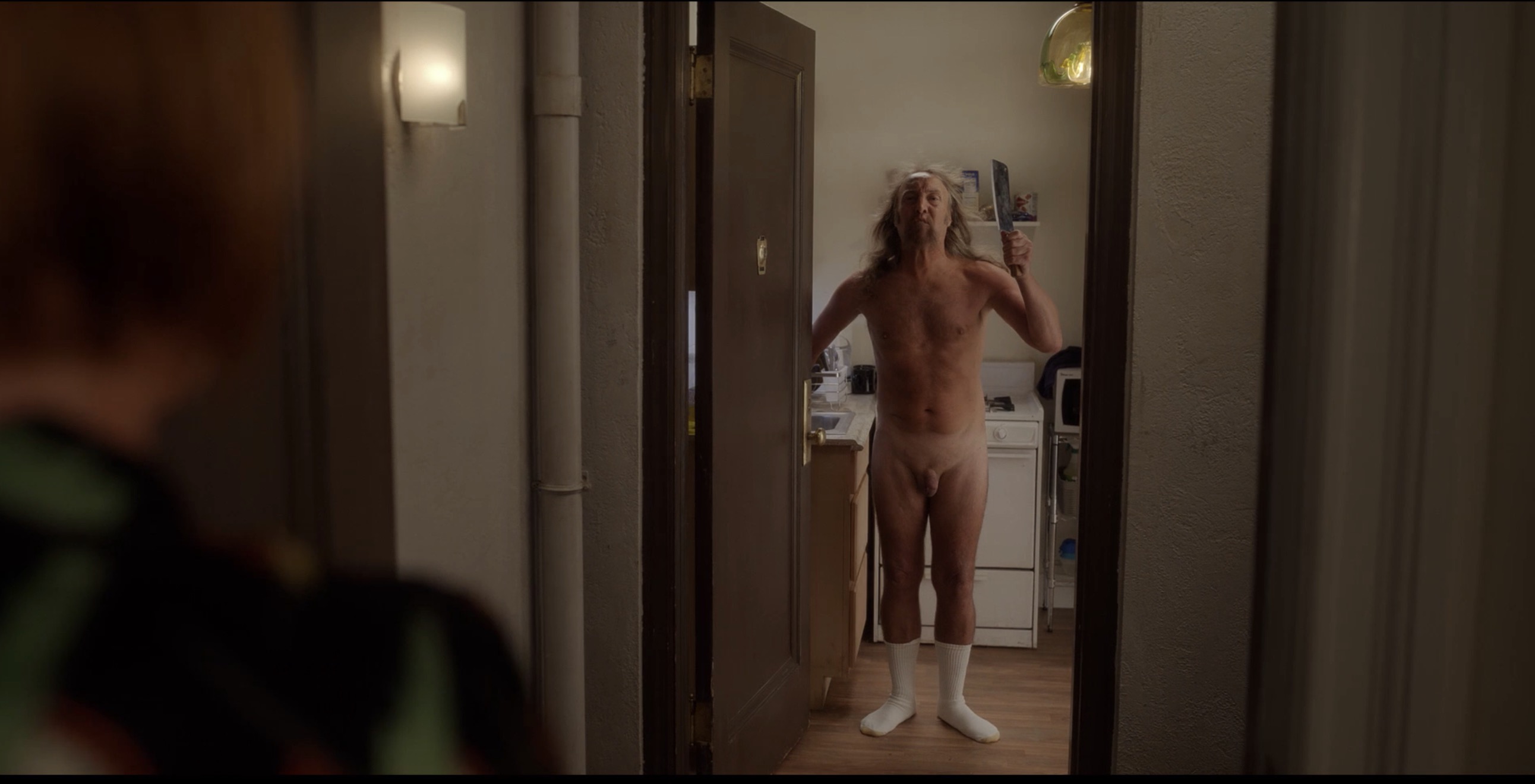 naked man with knife