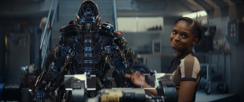 Riri pointing at her iron suit upgrades
