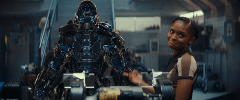 Riri pointing at her iron suit upgrades
