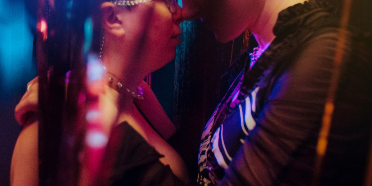 two people almost kissing at pride