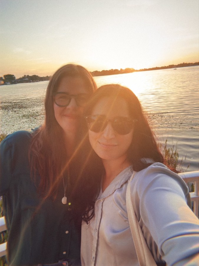 Kristen and Kayla with the sun setting behind them