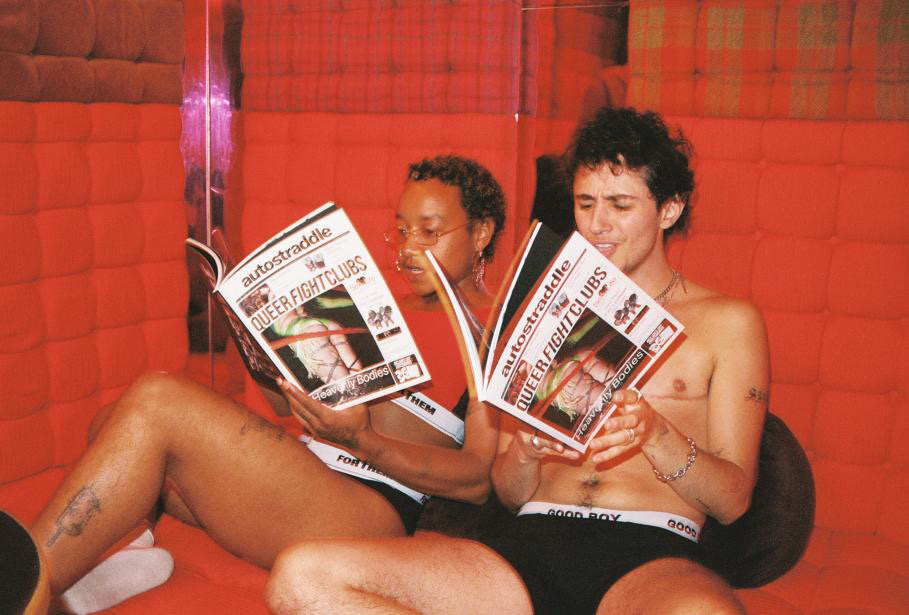two queer people holding the Autostraddle Insider