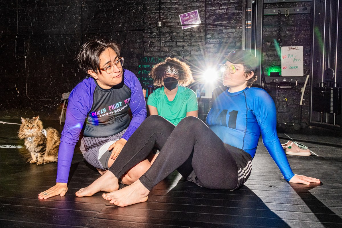 Mylo Mendez, left, begins the jiu-jitsu training with some basic moves on their partner Irina Groushevaia, right.
