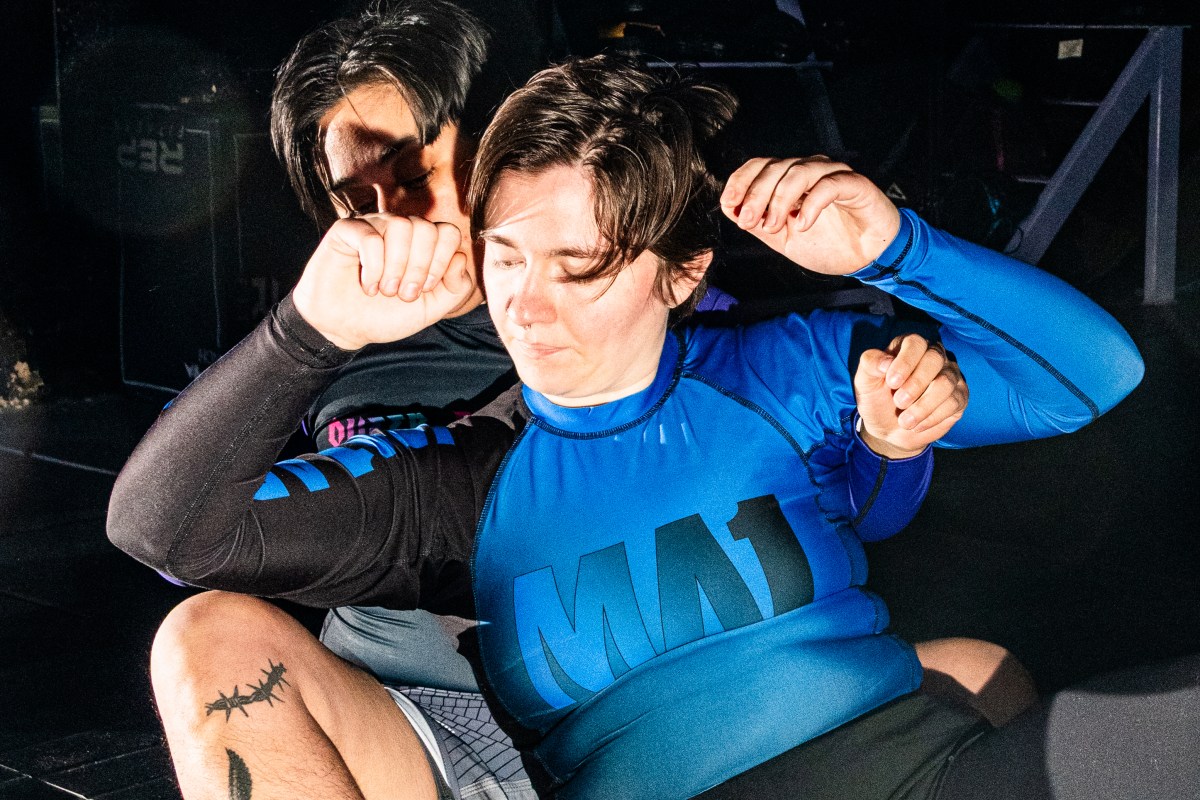 Mylo Mendez, upper left, and Irina Groushevaia, center, move around each other during the jiu-jitsu training.