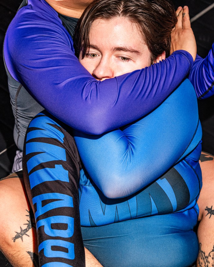 Irina Groushevaia is held in a chokehold from behind during the jiu-jitsu training.