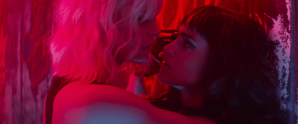 Top lesbian night club scenes: Charlize Theron holds Sofia Boutella up against a wall with a gun