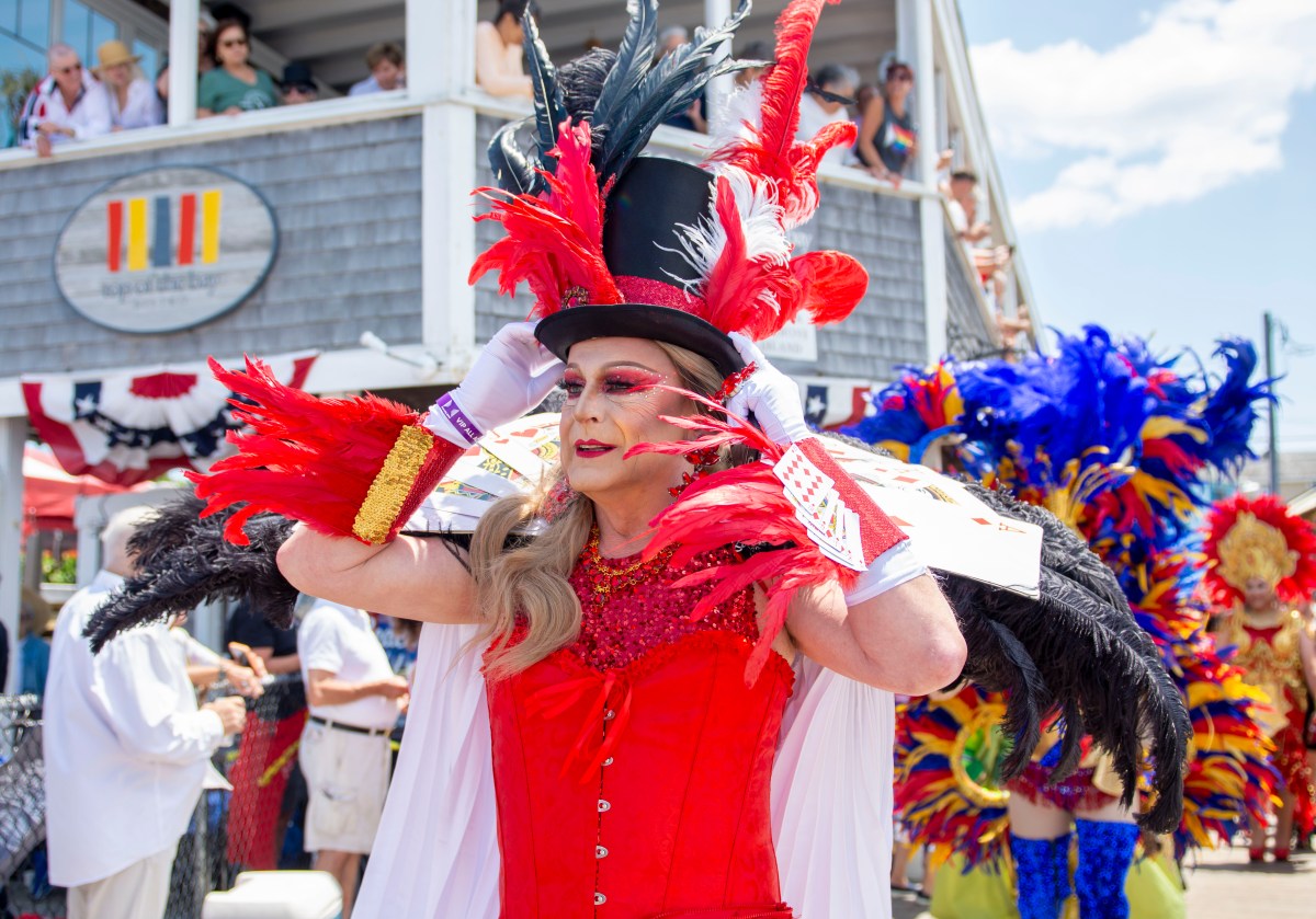a drag queen in a mad hatter outfit