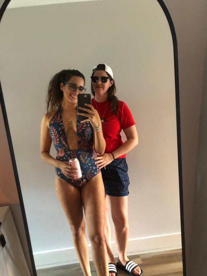 Kayla and Kristen in a mirror selfie in swimsuits