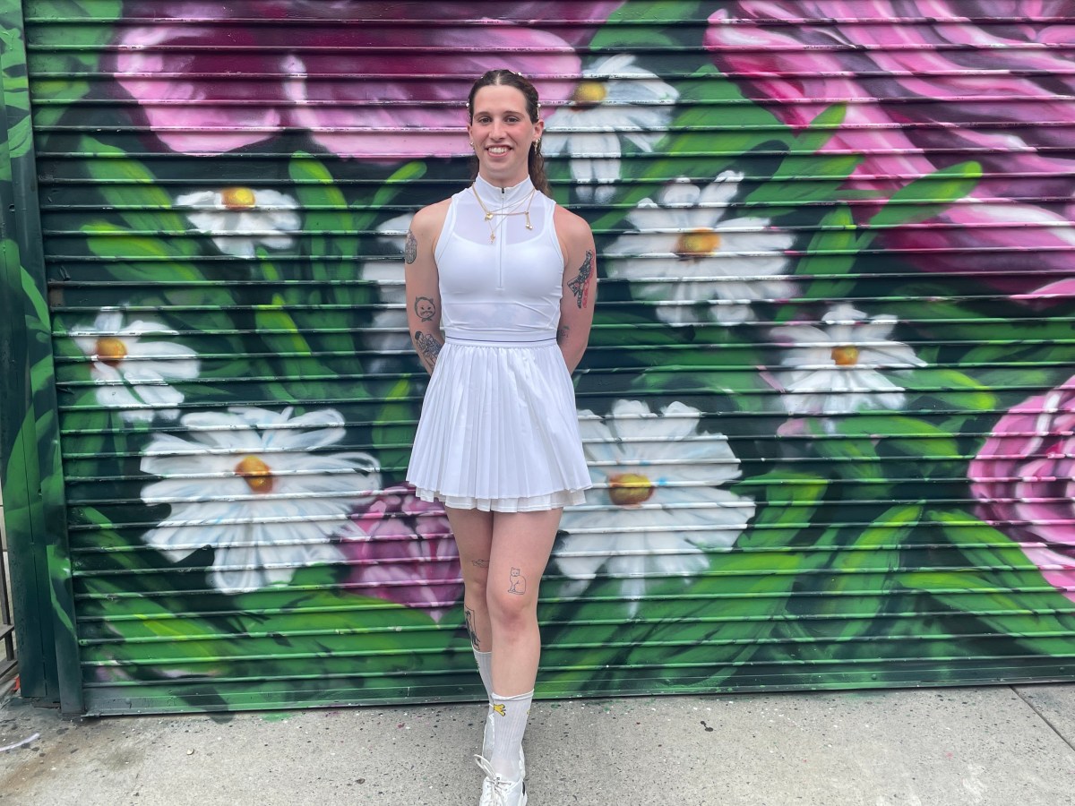Cammie Woodman in a white tennis dress