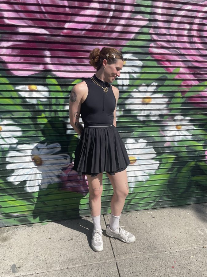 Cammie Woodman in a black tennis dress
