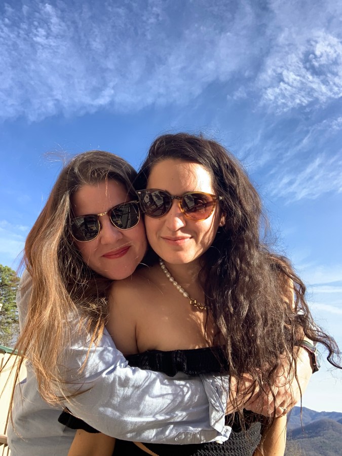 Kristen and Kayla with blue sky behind them