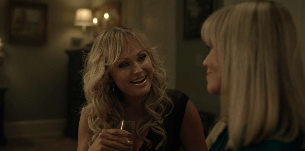 Margo in The Hunting Wives with curly hair