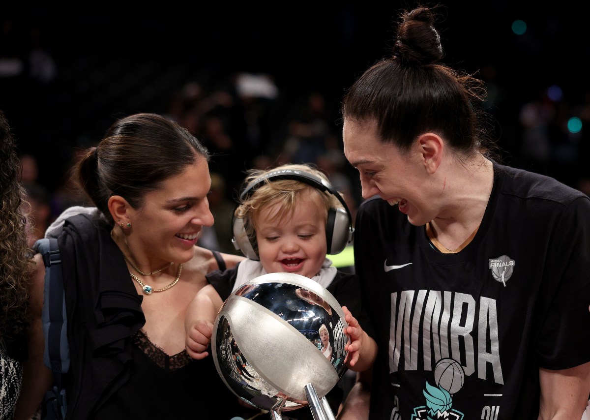 NEW YORK, NEW YORK - OCTOBER 20: Marta Xargay Casademont celebrates with her wife, Breanna Stewart #30 of the New York Liberty, after Game Five of the WNBA Finals against the Minnesota Lynx at Barclays Center on October 20, 2024 in the Brooklyn borough of New York City. The New York Liberty defeated the Minnesota Lynx 67-62 in overtime to win the championship. NOTE TO USER: User expressly acknowledges and agrees that, by downloading and or using this photograph, User is consenting to the terms and conditions of the Getty Images License Agreement. (Photo by Elsa/Getty Images)