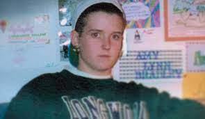 Amy Bradley in a backwards cap and sweatshirt