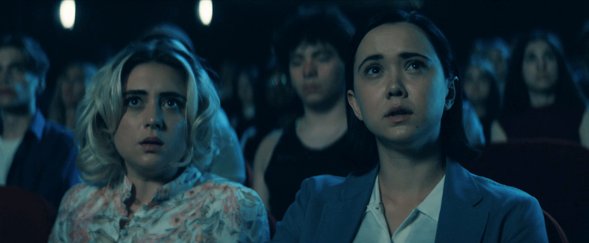 Gen V 201: Emma and Jordan look horrified in the audience listening to Cipher talk