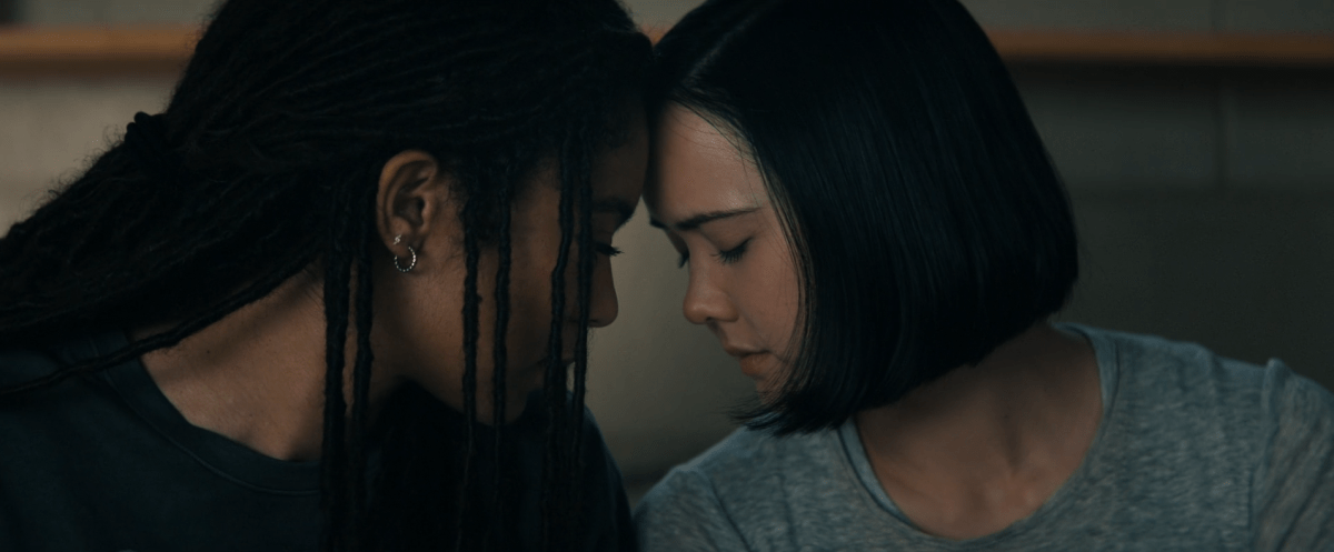 Marie and Jordan press foreheads together in a gay way