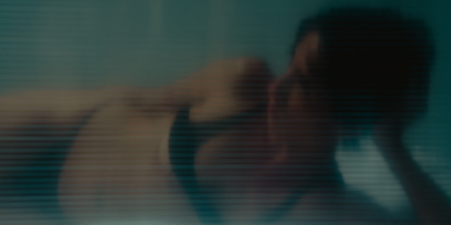 a person in a bra and underwear in repose