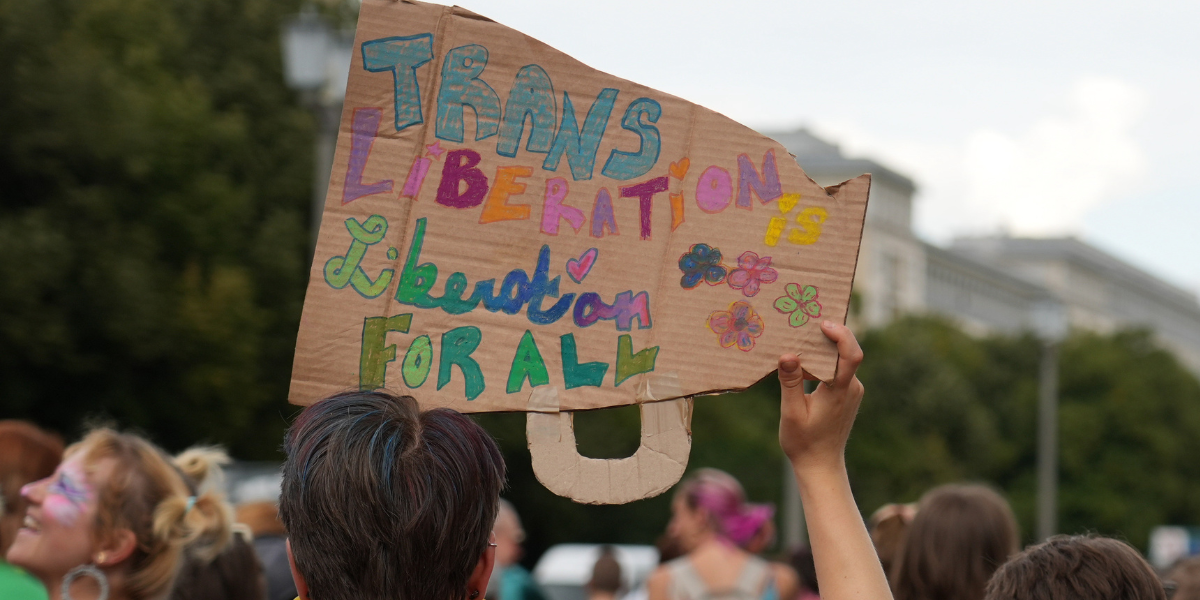 a sign that says Trans Liberation is Liberation for all