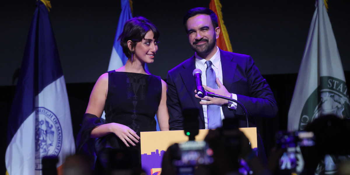 NEW YORK, NEW YORK - NOVEMBER 04: New York City Democratic mayoral candidate Zohran Mamdani and his wife Rama Duwaji celebrate as he takes the stage at his election night watch party at the Brooklyn Paramount on November 4, 2025 in the Brooklyn borough of New York City. Mamdani defeated Independent candidate Andrew Cuomo and Republican candidate Curtis Sliwa in the closely watched election for New York City mayor. (Photo by Spencer Platt/Getty Images)
