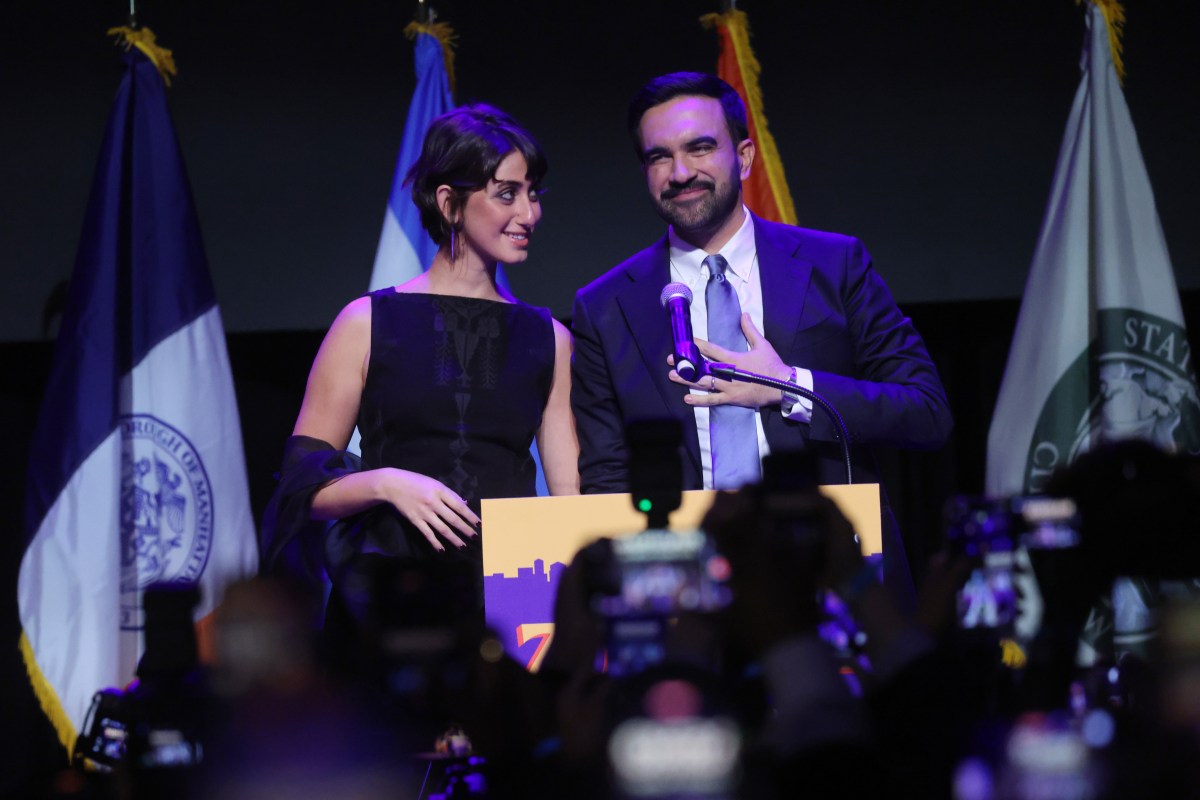 NEW YORK, NEW YORK - NOVEMBER 04: New York City Democratic mayoral candidate Zohran Mamdani and his wife Rama Duwaji celebrate as he takes the stage at his election night watch party at the Brooklyn Paramount on November 4, 2025 in the Brooklyn borough of New York City. Mamdani defeated Independent candidate Andrew Cuomo and Republican candidate Curtis Sliwa in the closely watched election for New York City mayor. (Photo by Spencer Platt/Getty Images)