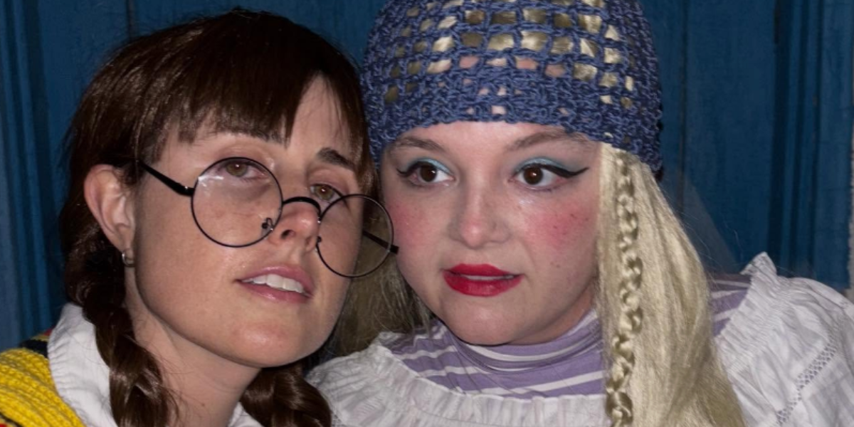 Meg Stalter and Maddie dressed as gay American Girl dolls Molly and Julie