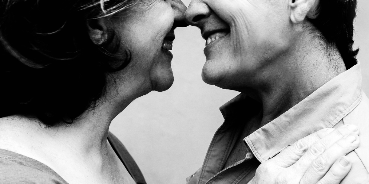 two older women about to kiss