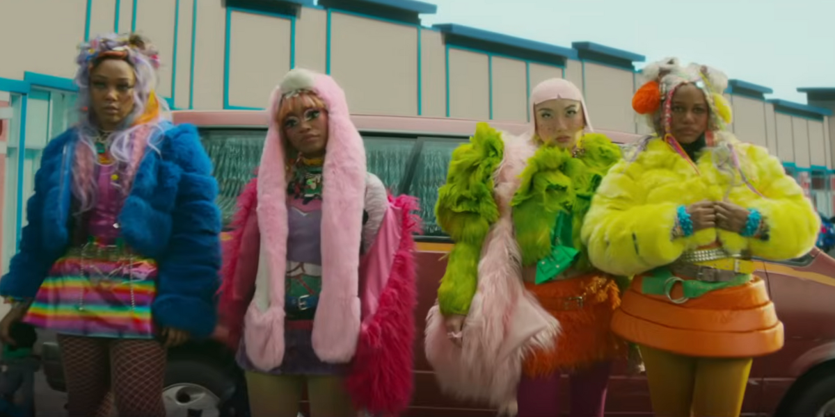 Screenshot from I Love Boosters trailer featuring the "Velvet Gang" which includes Keke Palmer and Poppy Lui dressed in colorful outfits and wigs