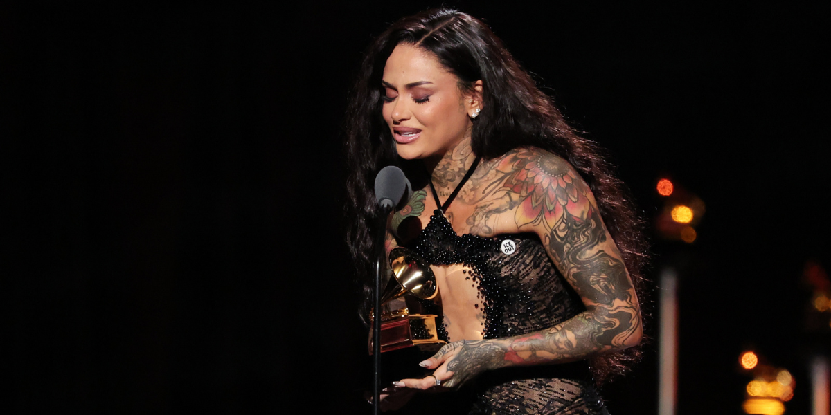 Kehlani accepting Grammy in ICE OUT pin