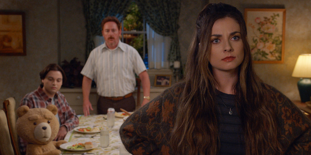 Ted Season 2: Blaire stands in the foreground with her hands on her hips, Ted, Johnny and Uncle Matty in the background