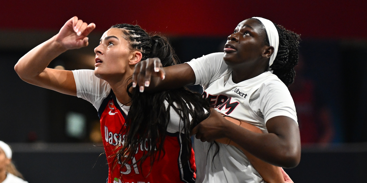 COLLEGE PARK, GEORGIA - MAY 03: Lauren Betts #51 of the Washington Mystics and Madina Okot #11 of the Atlanta Dream battle for position in the first quarter of a preseason game at Gateway Center Arena on May 03, 2026 in College Park, Georgia. NOTE TO USER: User expressly acknowledges and agrees that, by downloading and or using this photograph, User is consenting to the terms and conditions of the Getty Images License Agreement. (Photo by Paras Griffin/Getty Images)