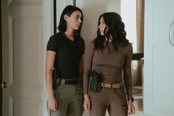 two hot women look at each other like they want to bang
